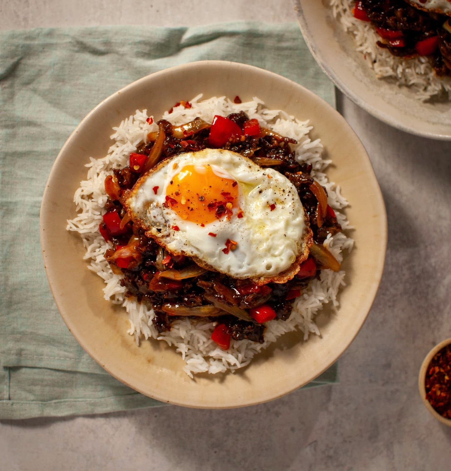 Mongolian stir-fried beef mince with fried egg and steamed rice